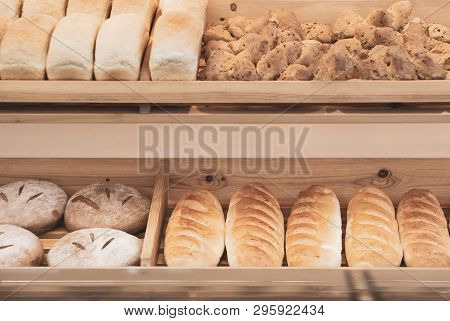 Background - Shelves In A Bakery With Fresh Bread Of Different Varieties In Muted Pastel Colors