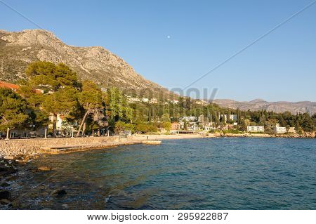 Mlini, Croatia - April 2019: Beach, Nature And Buildings In The Idyllic Village Of Mlini In Dubrovni