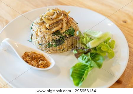 egg fried rice with fried Gourami with organic vegetable.