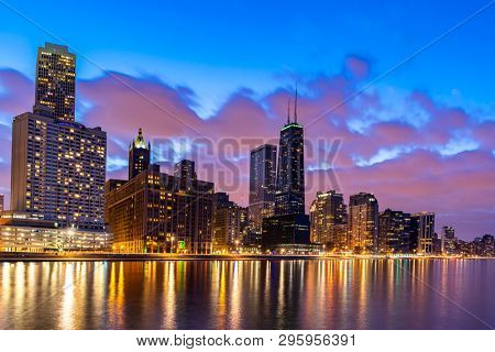 Sunset at Chicago Skylines building at Chicago downtown along Lake Michigan in Chicago City Illinois USA. Take from Ohio Street beach Milton Lee Olive Park. 