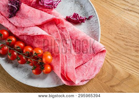 Lavash with tomatoes (soft, thin unleavened flatbread)