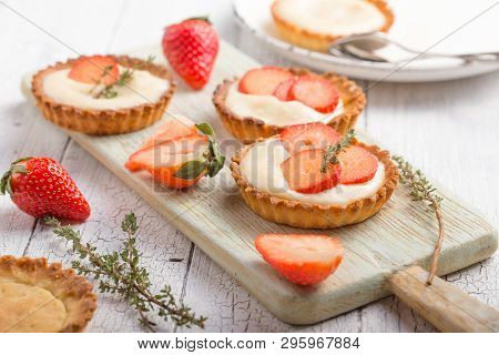 Fresh Fruit And Berry Tart Dessert  On Wooden Background. Delicious Sweet Tart Cake With Strawberrie