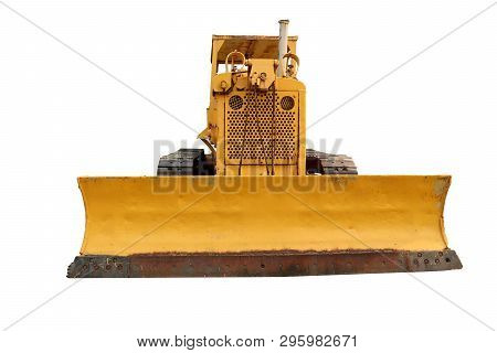 Old Yellow Rusty Crawler Tractor In The Field. Old Crawler Tractor 
Isolated On White Background. 
H