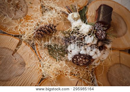 Wedding Bouquet With Cotton, Pine Cones, Lotus, Brunia And Thuja Tied With White Lace With A Vintage