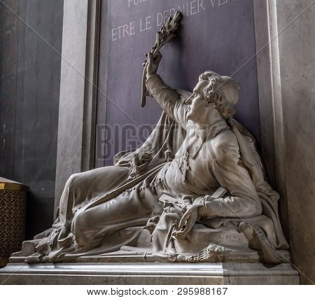 Paris, France, March 27, 2017: Denys Affre statue inside Notre Dame. Archbishop, killed in 1848. With inscription, Puisse mon sang etre le dernier verse. May my blood be the last that is shed