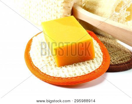 Natural Luff Sponge With Orange Soap On White Background