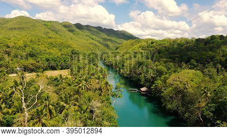 The River In The Rainforest Among The Green Lush Vegetation. Loboc River View From The Top. Bohol, P