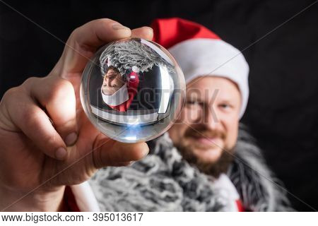 Cheerful Santa Dressed In Fur Skin With Crystal Spehre
