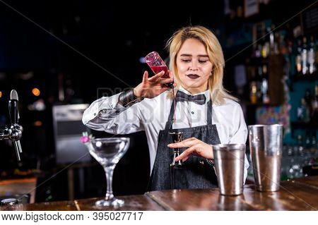 Girl Barman Creates A Cocktail At The Brasserie