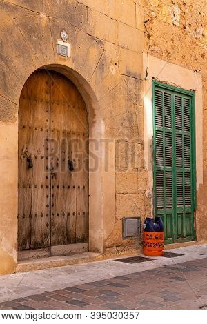 Campos, Balearic Islands/spain; November 2020: An Empty Butane Cylinder At The Door Of A House Waiti