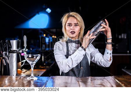 Girl Barman Formulates A Cocktail On The Pothouse