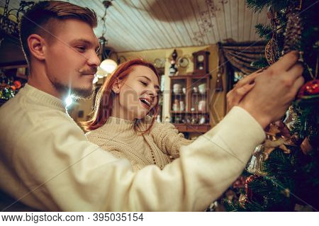 Christmas Tree. Smiling Family, Couple Looking For Home Decoration And Holidays Gifts In Household S