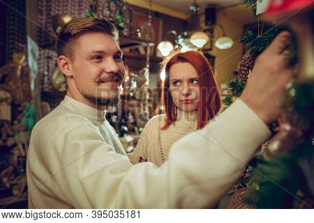 Christmas Tree. Smiling Family, Couple Looking For Home Decoration And Holidays Gifts In Household S