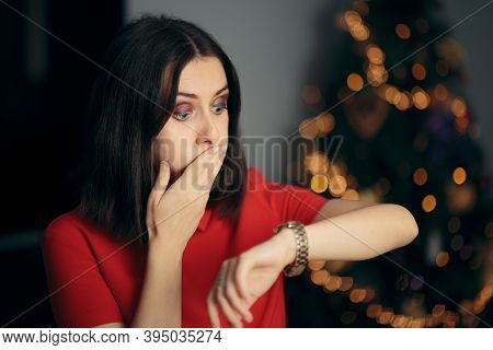 Woman Checking The Time Being Late For Christmas Party