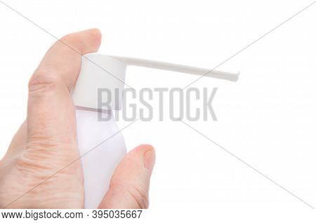 Close-up Of Hand Holding Throat Spray Isolated On White Background. Concept: Treatment Of First Sign