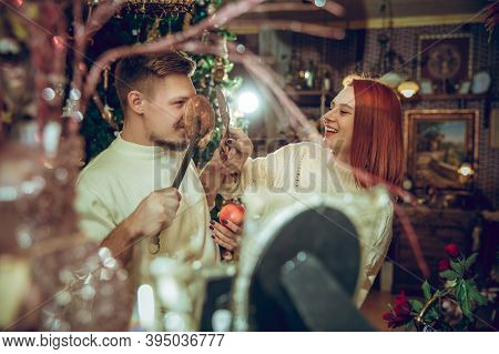 Comfortable. Smiling Family, Caucasian Couple Looking For Home Decoration And Holidays Gifts In Hous