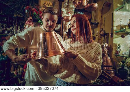 Golden. Smiling Family, Caucasian Couple Looking For Home Decoration And Holidays Gifts In Household