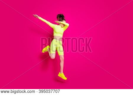 Full Length Body Size Photo Of Jumping Sportswoman Wearing Yellow Sportswear Sneakers Showing Hype I