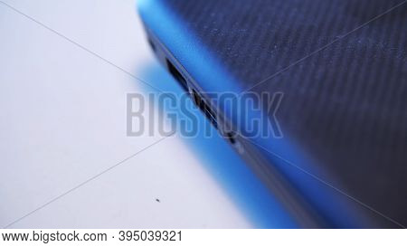 Process Of Charging Device With A White Usb Cable. Media. Close Up Of Male Hands Removing The White 