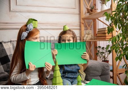 Playful. Two Little Children, Girls Together In Creativity Of The House. Happy Kids Make Handmade To