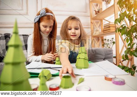 Playful. Two Little Children, Girls Together In Creativity Of The House. Happy Kids Make Handmade To