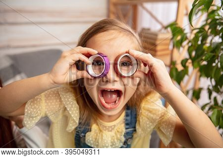 Laughting. Happy Children, Girl Having Fun In Creativity Of The House. Happy Kid Makes Handmade Toys