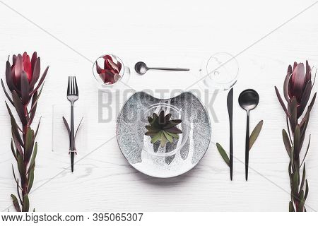 Elegant Table Setting With Floral Decor On White Wooden Background, Flat Lay