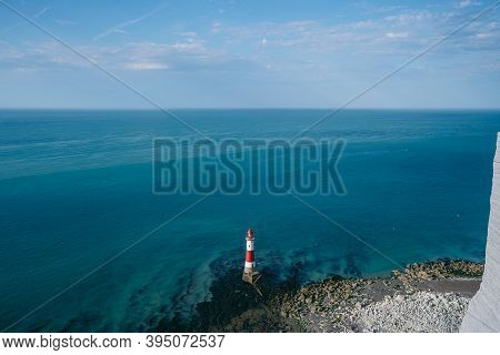 Landscape Photo Of A Beachy Head Lighthouse And Chalk Cliffs At Colorful Sunrise  With Low Tide In E