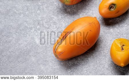 Overripe Rotten Yellow Tomatoes. Fruits With Phytophthora Infestans On A Gray Background.