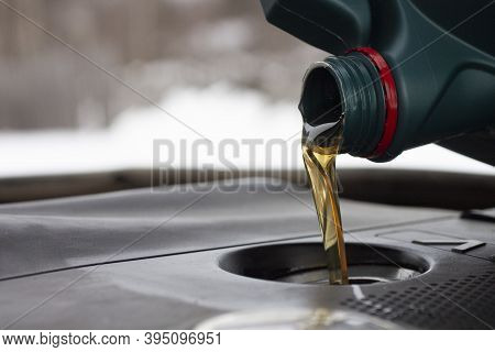 Refueling Fresh Engine Oil. Filler And Conistra Close-up