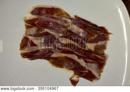 Slices Of Spanish Iberian Ham. It Is One Of The Most Exquisite Pork Products