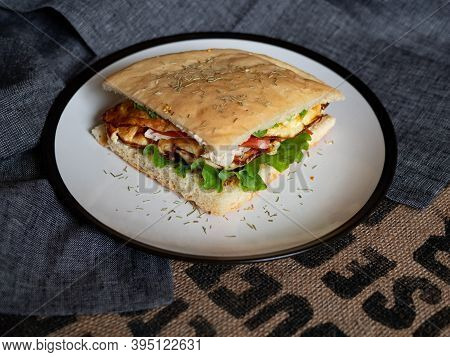 Craft Food. Delicious Juicy Sandwich With Chicken, Fried Egg, Tomato And Fresh Salad.