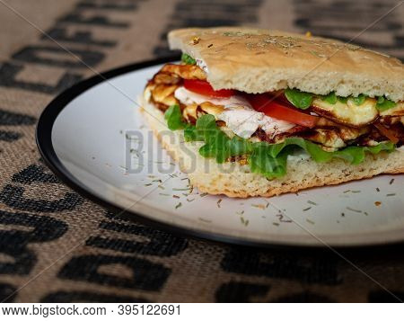 Craft Food. Delicious Juicy Sandwich With Chicken, Fried Egg, Tomato And Fresh Salad.