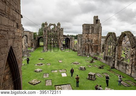 Elgin, Scotland - August 8, 2019: The Courtyard Of Elgin Cathedral With Tourists Taking Pictures On 