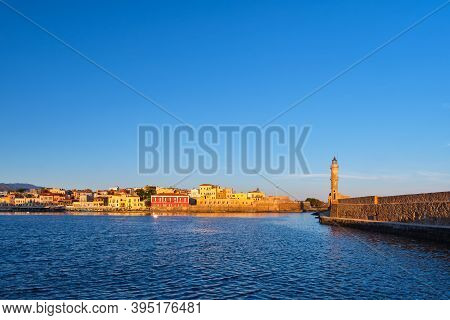 Iconic View Of Old Venetian Harbour , Chania, Crete, Greece In Morning. Famous Old Port Lighthouse, 