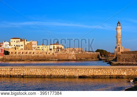 Beautiful Morning View Of Venetian Lighthouse, Firka Castle Walls And Piers Of Old Venetian Harbour 
