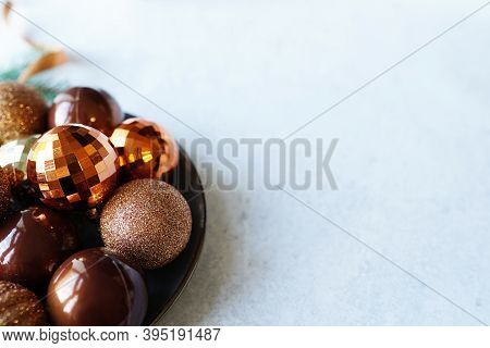 Christmas Table With Colden And Brown Balls Toys On Plate, Gray Background