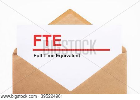 A White Sheet With The Text Fte Lies In An Open Craft Envelope On A White Background With Copy Space
