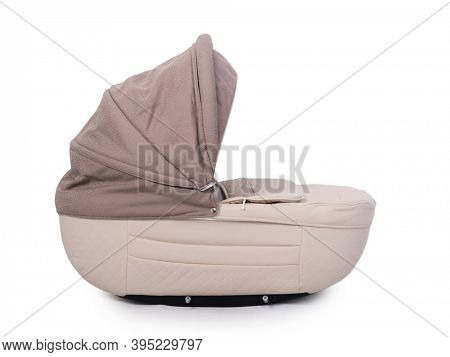 Beige carrycot stroller isolated over white background