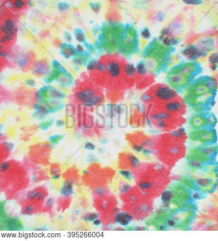 Rainbow Tye Dye Spiral. Dyed Texture. Rainbow Watercolor Roll. Fabric Design. 1960s Style Background