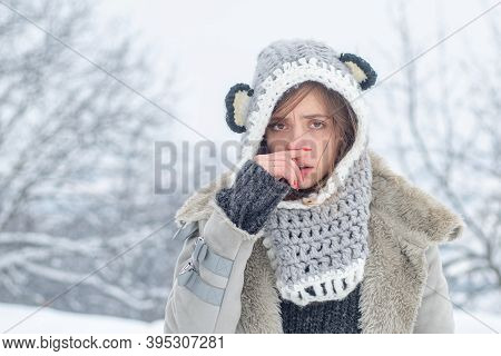 Sick In Winter. Cold Flu Winter Season, Runny Nose. Showing Sick Woman Sneezing At Winter Park. Youn