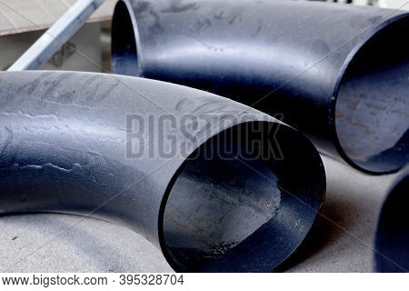 Black Metal Pipes And Adapters Of Different Diameters For Gasification Or Water Supply. Industrial B