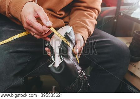Shoemaker Making Shoe Preparation Using Shoemaker Tools