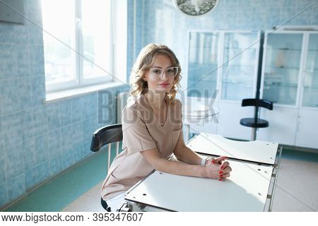 Female Doctor Surgeon Working At Surgery Room And Smiling At Camera.