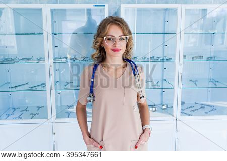 Female Doctor Surgeon Working At Surgery Room And Smiling At Camera.
