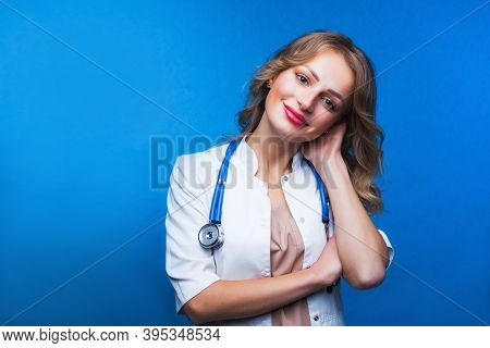 Young Doctor Woman Over Isolated Background Smiling In White Coat.