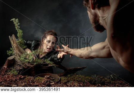 The Young Man Rescues The Girl By Holding Out His Hand To Her. The Image On The Theme Of The Post-ap