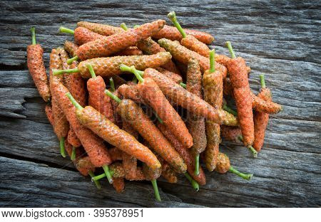 Long Pepper On Wood Background, Food Ingredient
