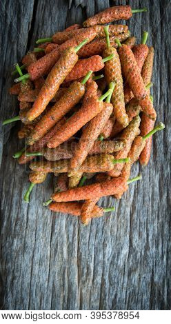 Long Pepper On Wood Background With Space For Text