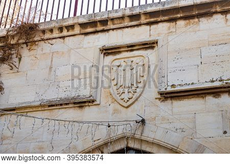 The Hospitaller Coat Of Arms Carved From Stone On The Wall In The Muristan Street In The Christian P